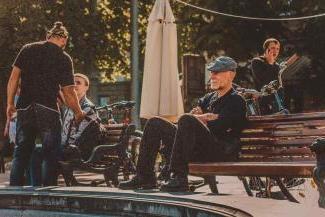 Man sitting on bench in park